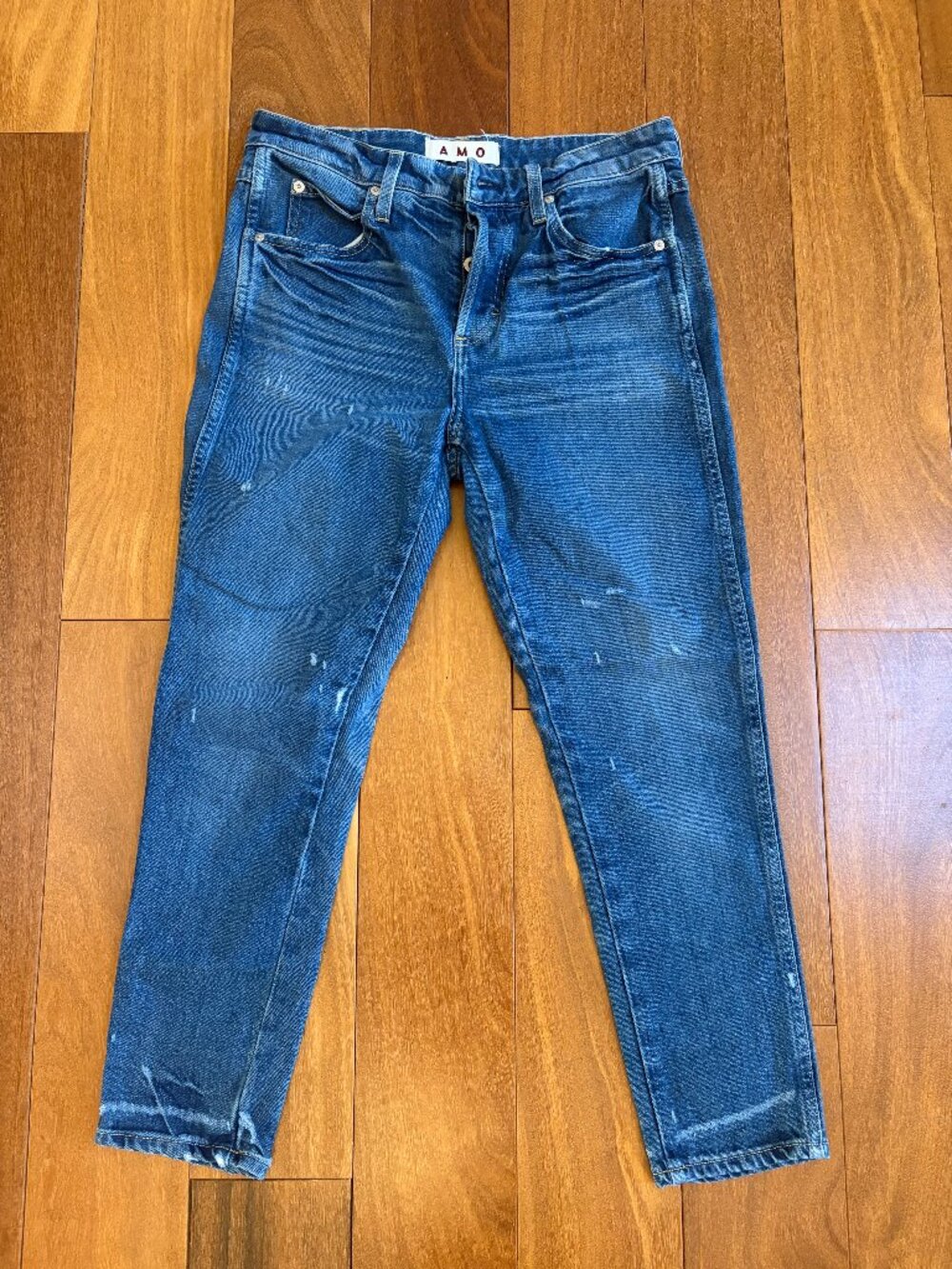 AMO Ace blue denim jeans features a vintage wash with subtle distressing